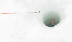 Fishing reel on frozen lake