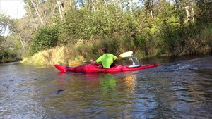 Kayaker paddling on the White River