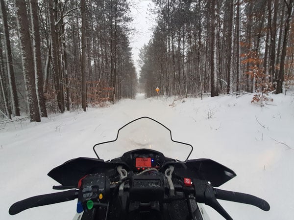 snowmobile on snowy trail