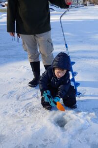 Parent and child ice fishing
