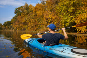 Kayak on water in fall