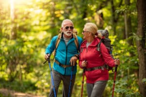 Older couple hiking in spring