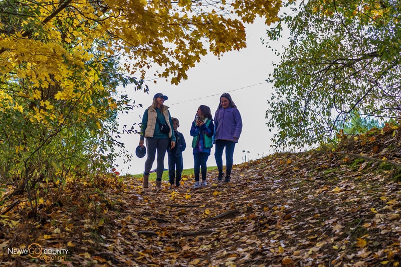 Family hiking Branstrom Park in fall